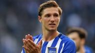 Niklas Stark applauds Hertha Berlin's fans at the end of a tough game